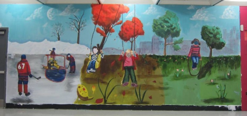 At St. Gabriel School, small teams of Grade 6 artists worked with three graduate artist facilitators to create murals within the school. This work portrayed fun things the students love to do outside, though the seasons.